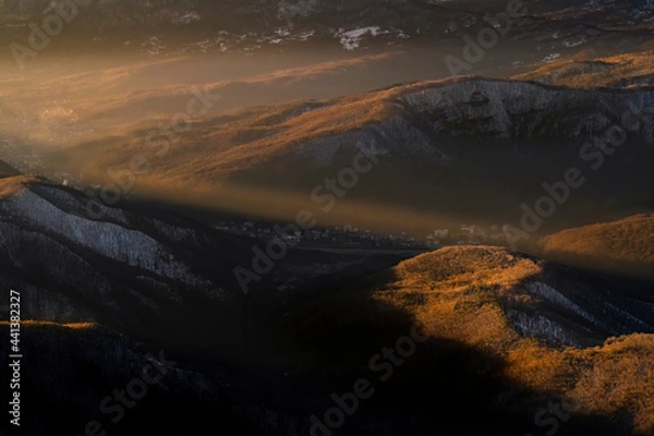 Obraz Sunlight rays traversing the valley