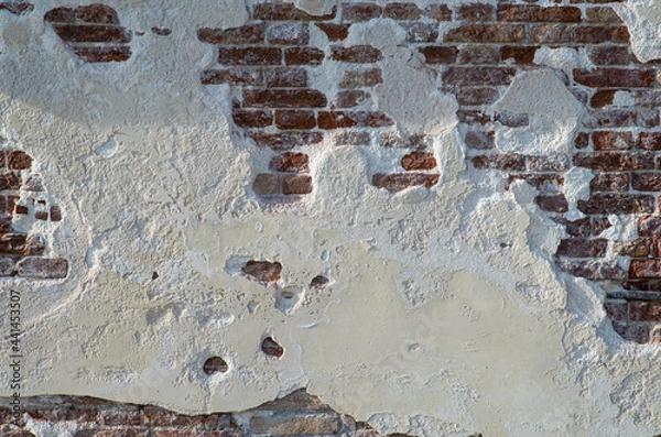 Obraz Wall texture with white wall and bricks from a venetian alley