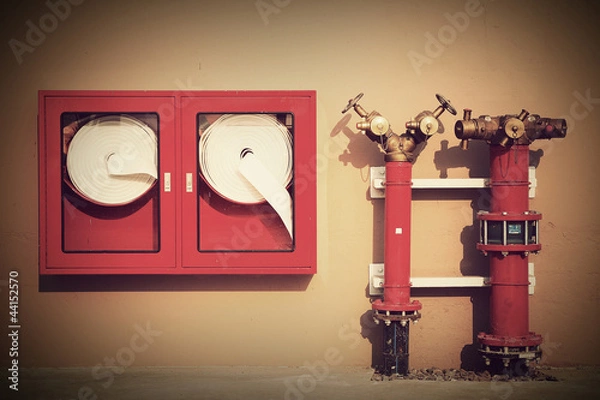 Obraz Vintage Hydrant with water hoses and fire extinguish equipment