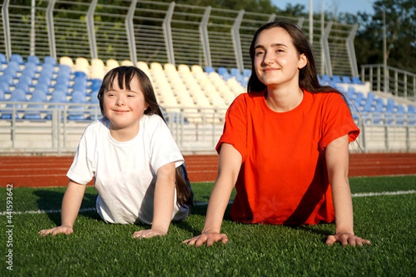 Obraz Little girl on the stadium with a coach