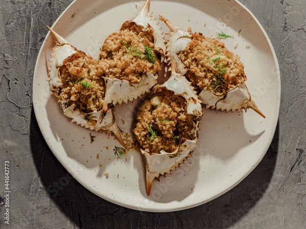 Obraz Close up of stuffed blue crabs on white plate