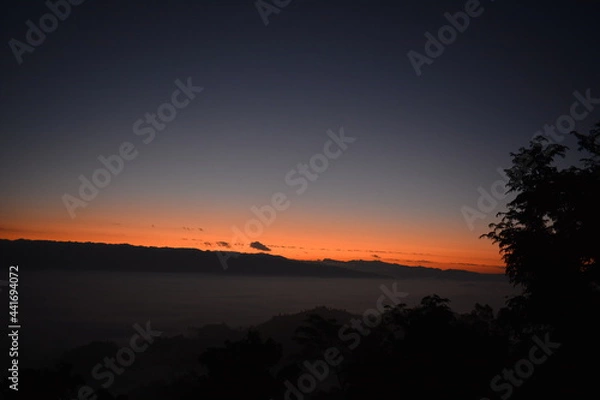 Fototapeta sunset over the river Clouds