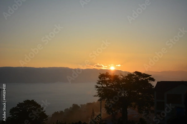 Fototapeta sunset over the Clouds