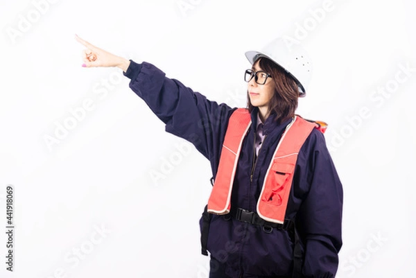 Obraz 遠くを指差すエンジニアの女性