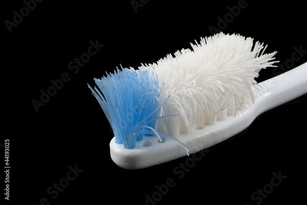 Obraz Bad toothbrush on black isolated