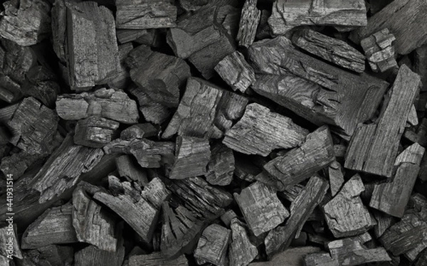 Fototapeta Background texture of many black charcoal pieces