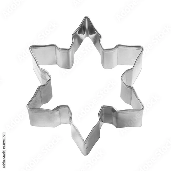 Fototapeta Baking dish for Christmas cookies in the shape of snowflake isolated on white