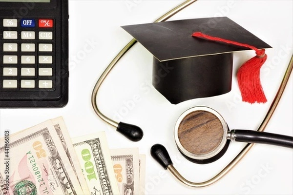Fototapeta Money for medical education. Financial opportunity to save up and spend on training.
