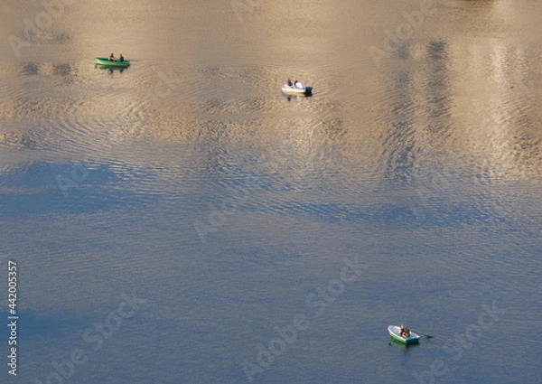 Fototapeta Top view of three boats on the water surface.