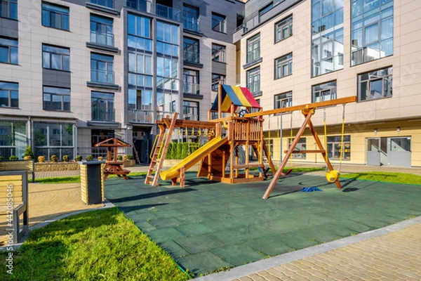 Fototapeta playground on the territory of a modern multi-storey residential complex
