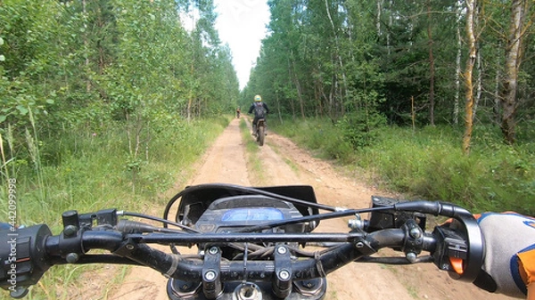 Obraz View from the enduro sports bike to the steering wheel and off-road track