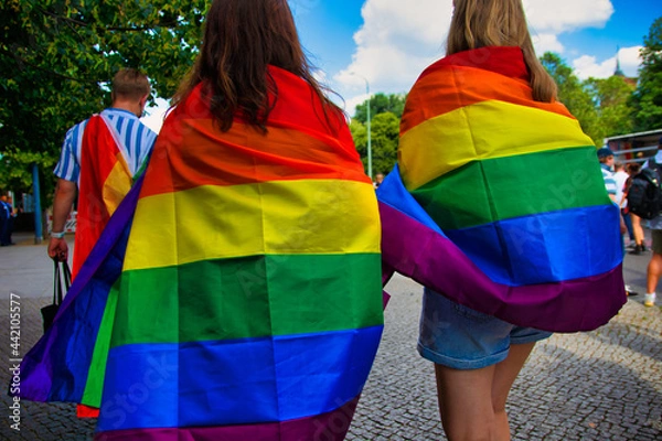 Obraz Two women carry a rainbow flag on Christopher Street Day (CSD)