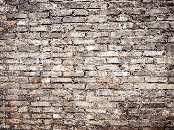 Fototapeta Seamless red brick wall background.Old red brick grunge wall background. 

A deteriorating old brick wall of an 18th century fort.
