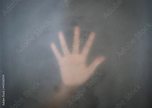 Obraz Silhouette hands behind the mirror Abstract style, One hand on a glass partition with blurry. Illustration of designer