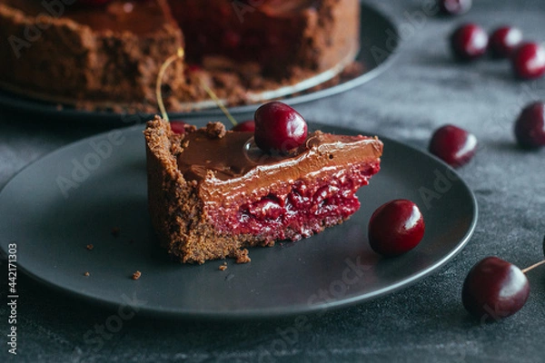 Obraz Pie with chocolate and cherries. Delicious cake on a plate