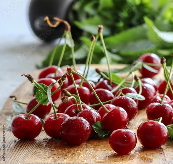 Obraz Fresh ripe cherries on wooden background