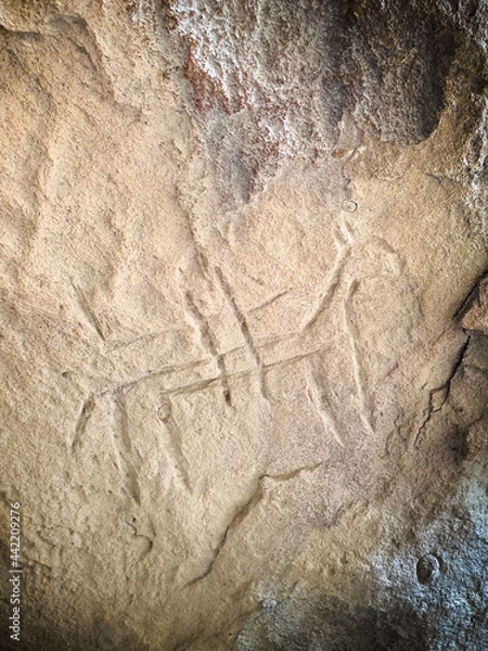 Fototapeta Ancient rock carvings petroglyphs of people with boat in Gobustan National park. Exposition of Petroglyphs in Gobustan near Baku, Azerbaijan.