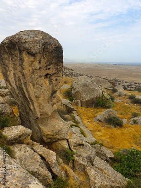 Fototapeta Gobustan national park ancient rocks, rock path and mountains near Baku in Azerbaijan. Exposition of Petroglyphs in Gobustan near Baku, Azerbaijan.