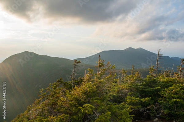 Obraz Sun going down over mountain range
