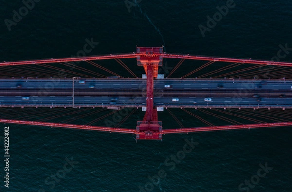 Obraz Aerial birds eye overhead top down view of cars driving on multilane road suspension bridge over Tagus river. Lisbon, Portugal.