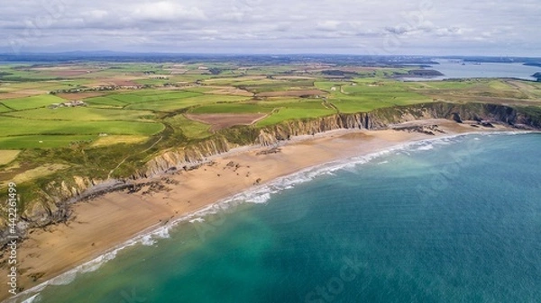 Fototapeta Gateholm Island at Marloes Beach, Pembrokeshire, Wales, drone aerial shot with copy space