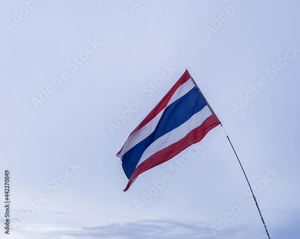 Obraz National flag of Thailand waving in cloudy sky