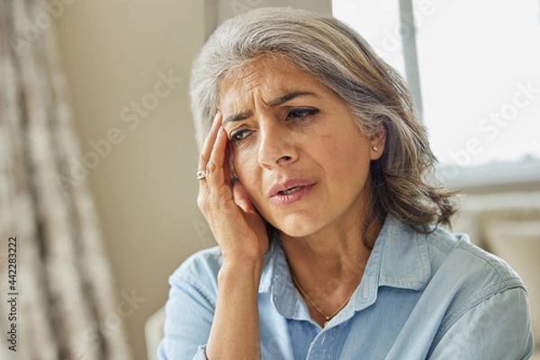 Obraz Mature Woman At Home Suffering From Headache Or Memory Loss