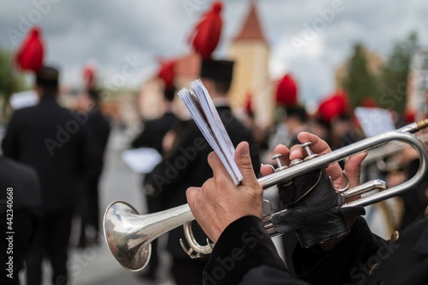 Obraz Detail of trumpet with man's hands in the background mining orchestra.
