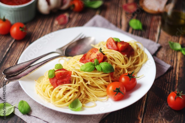 Obraz Italian pasta spaghetti with basil and cherry tomatoes