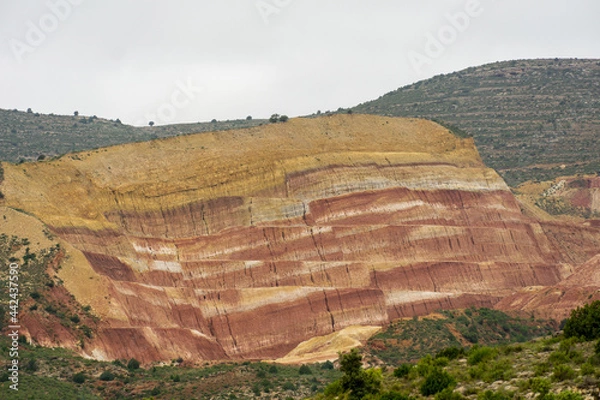 Fototapeta Kaolin and clay mining using mine benches with berms and slopes in Spain.