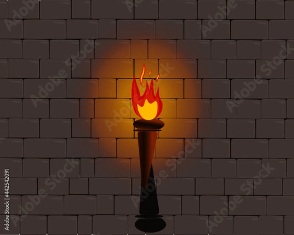 Fototapeta flaming torch throwing glow of light on castle wall
