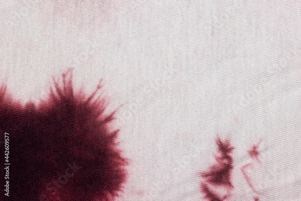 Fototapeta White fabric with red paint stain. Background