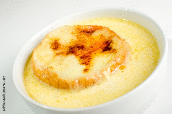 Fototapeta Onion soup on white bowl