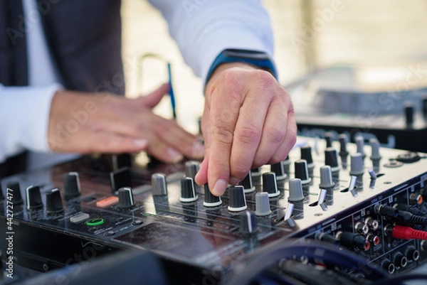 Obraz DJ in the mix, closeup on the hands