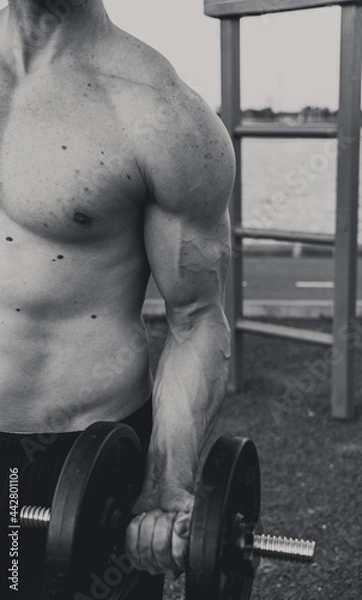 Fototapeta man lifting weights