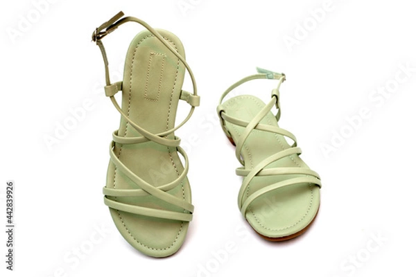 Fototapeta Women's summer sandals on a white background, top view