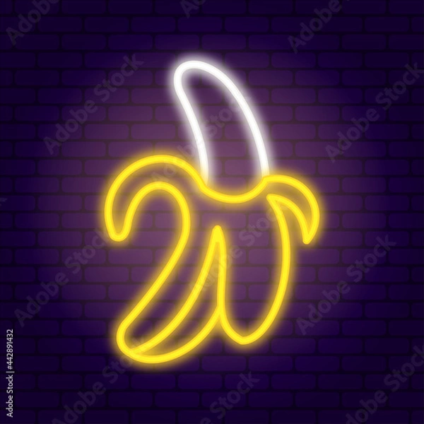 Fototapeta Neon banana on dark brick wall background