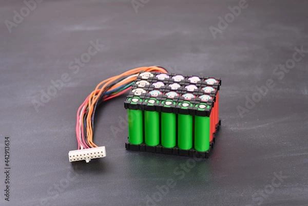 Fototapeta Lithium battery pack on dark background.
