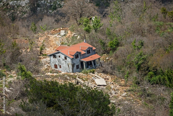 Obraz Destruction of a new home in a landslide after heavy rains