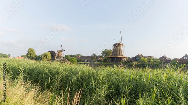 Fototapeta Traditional dutch windmills De Vriendschap and De Eendragt in the city of Weesp