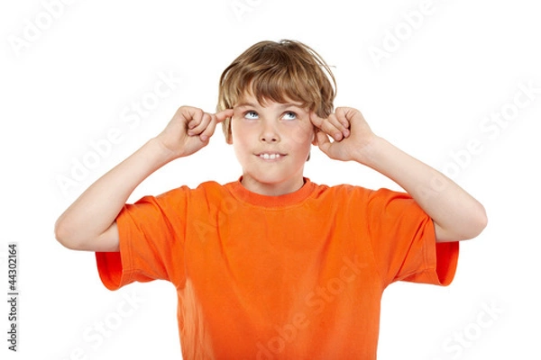 Fototapeta Portrait of smiling boy in orange t-shirt with rolled eyes
