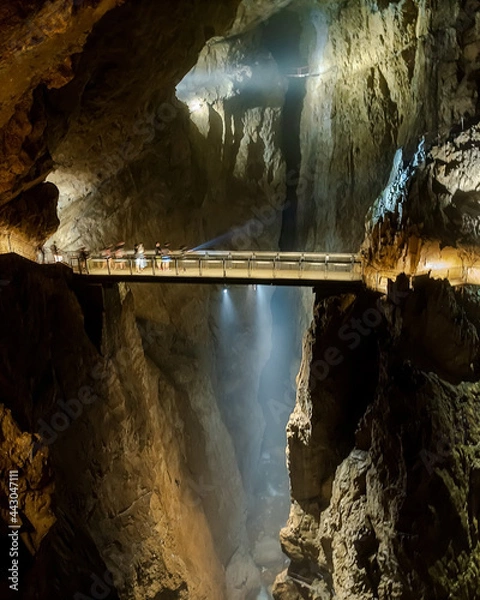 Fototapeta Inside of skocjan cave in Slovenia. Amazing double cave system. The first part is a dripstone cave. The an other part is a karst cave it has river on bottom  which name is Reka.