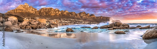 Obraz Breathtaking sunset panorama of the iconic Table Mountain and the Twelve Apostles range, Cape Town South Africa. A unique and scenic wide-angle perspective taken from Maidens cove beach