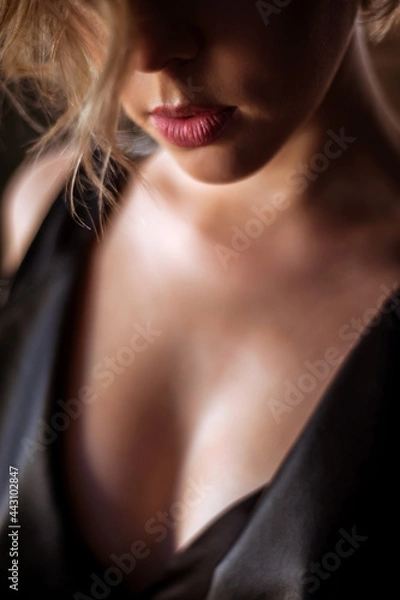 Fototapeta Girl posing on a black background in a photo Studio