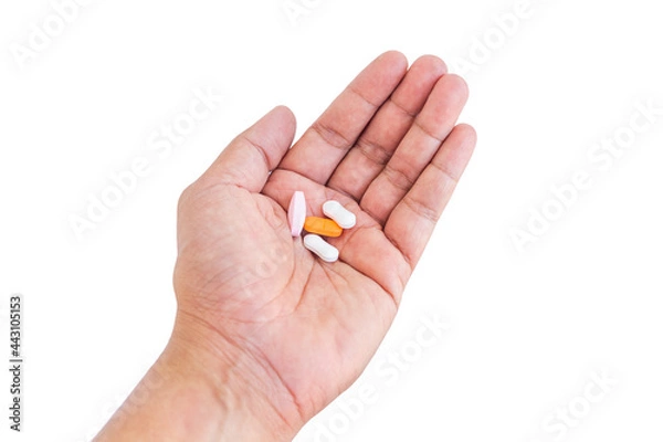 Obraz pills in hand on white background