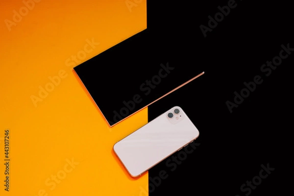 Obraz Close up glass, phone, notebook and mint on colors background 