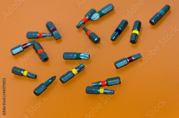 Obraz multi-colored bits from a screwdriver, tools for assembly, free space for insertion, selective focus