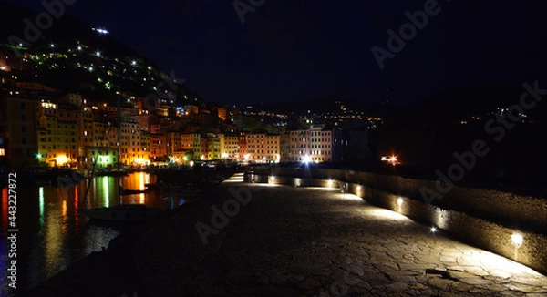 Fototapeta incredible view of the small port of Camogli in the evening, lights, colors and reflections on the sea create a magical atmosphere