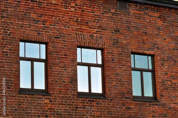 Fototapeta Three windows in a brick wall