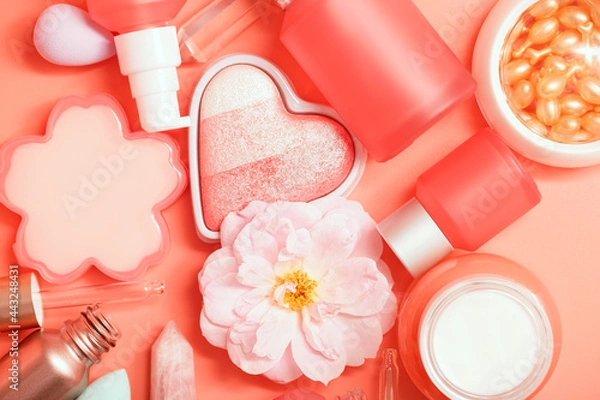 Fototapeta Various cosmetic care products in frosted bottles with dispensers and pipette. Beautiful clean bottles and jars for cream, essence, lotion